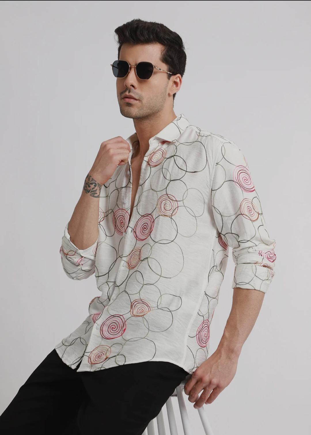 Embroidered white circular shirt.