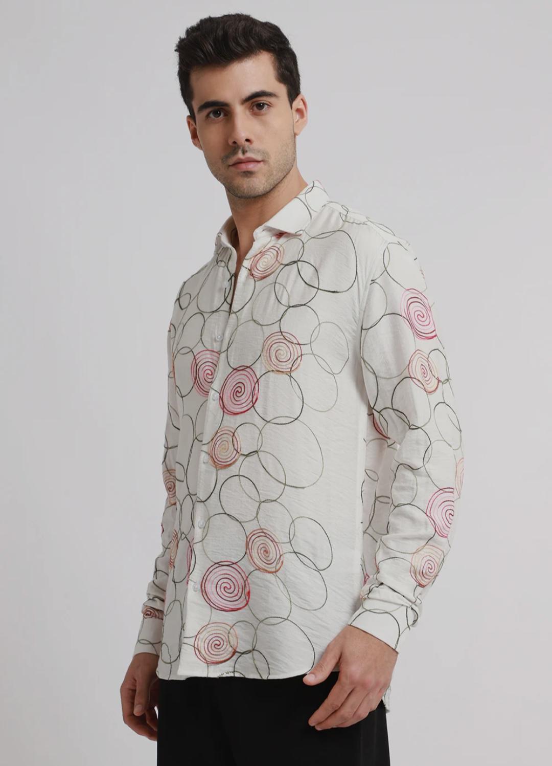 Embroidered white circular shirt.