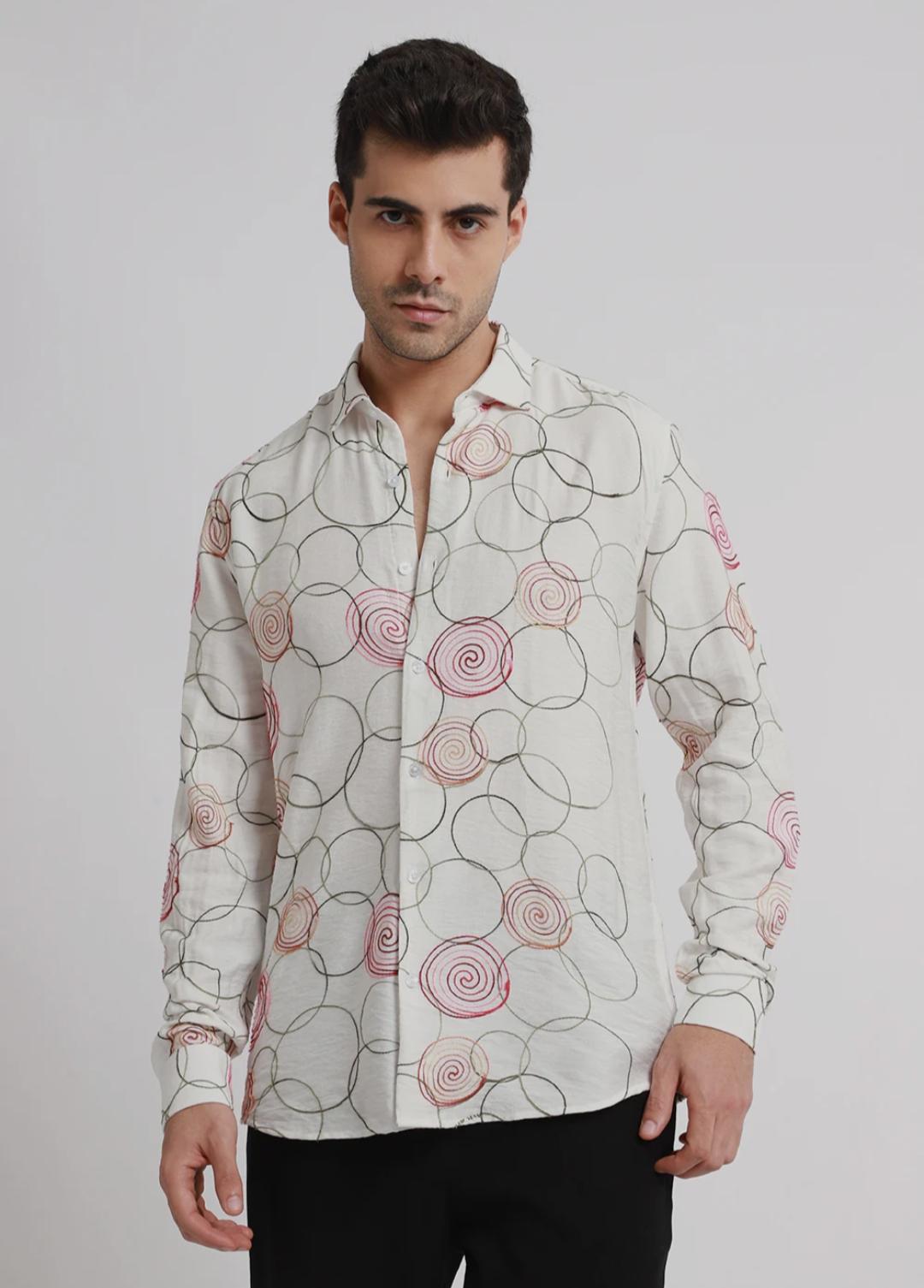 Embroidered white circular shirt.