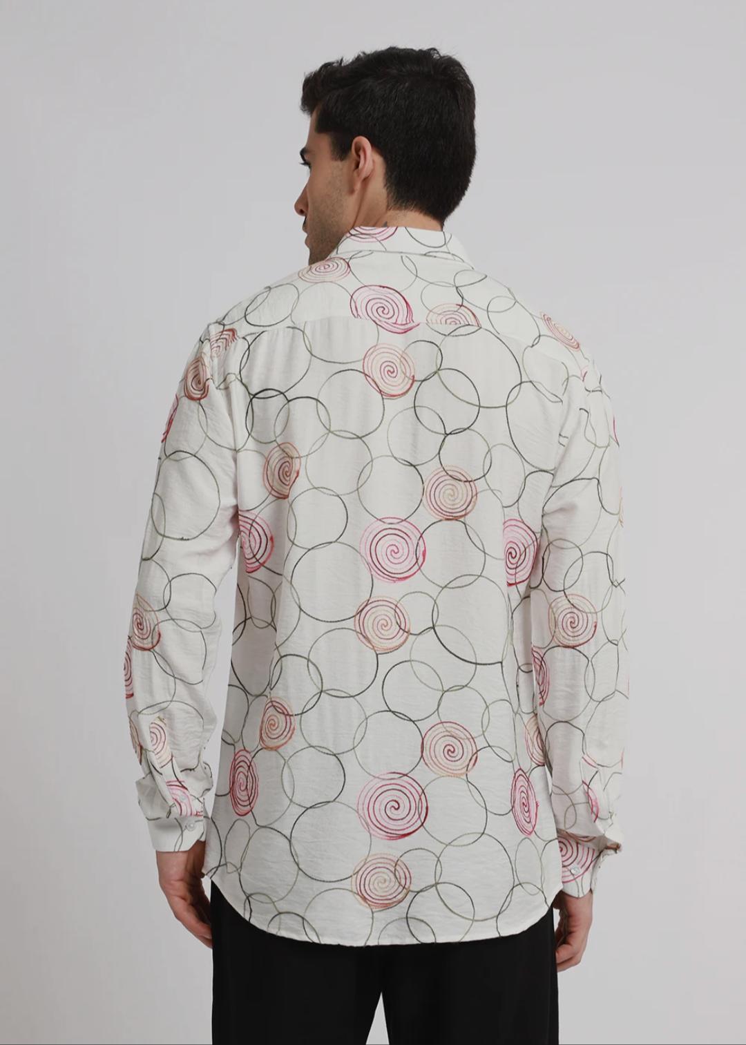 Embroidered white circular shirt.