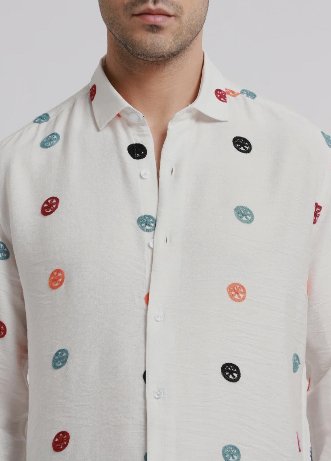 White embroidered shirt.