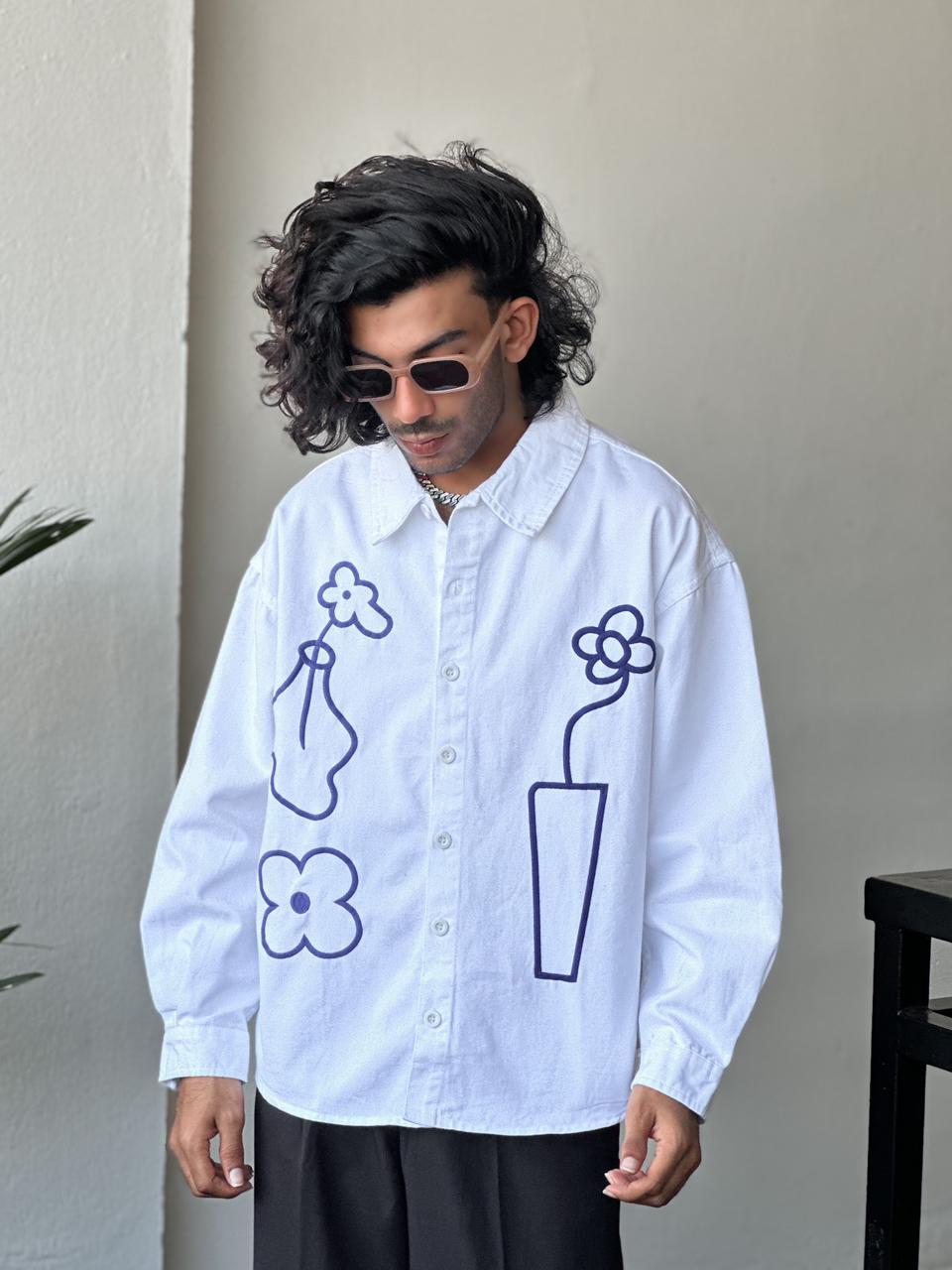 White floral embroidered shirt.