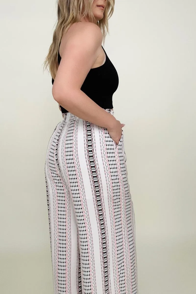 Wide leg pants with geo stripe and smocked waist.