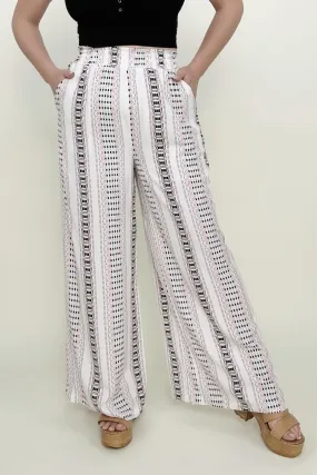 Wide leg pants with geo stripe and smocked waist.