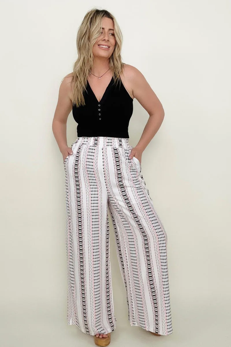 Wide leg pants with geo stripe and smocked waist.