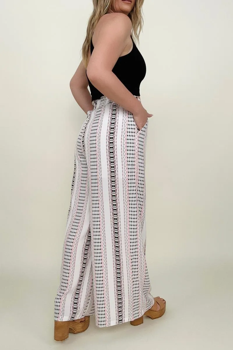 Wide leg pants with geo stripe and smocked waist.