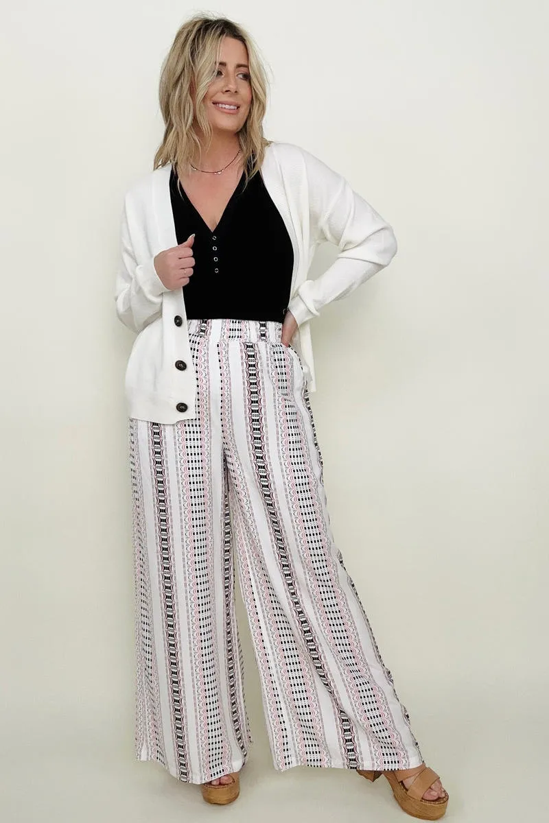 Wide leg pants with geo stripe and smocked waist.