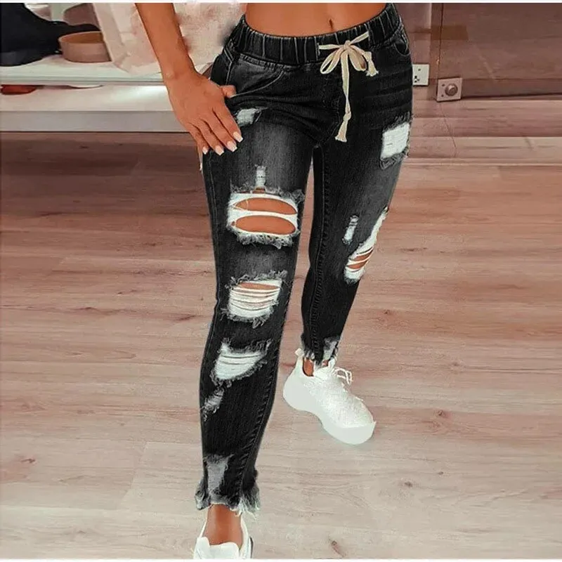 Women's Ripped Jeans with Hollow Out Design and Drawstring Closure